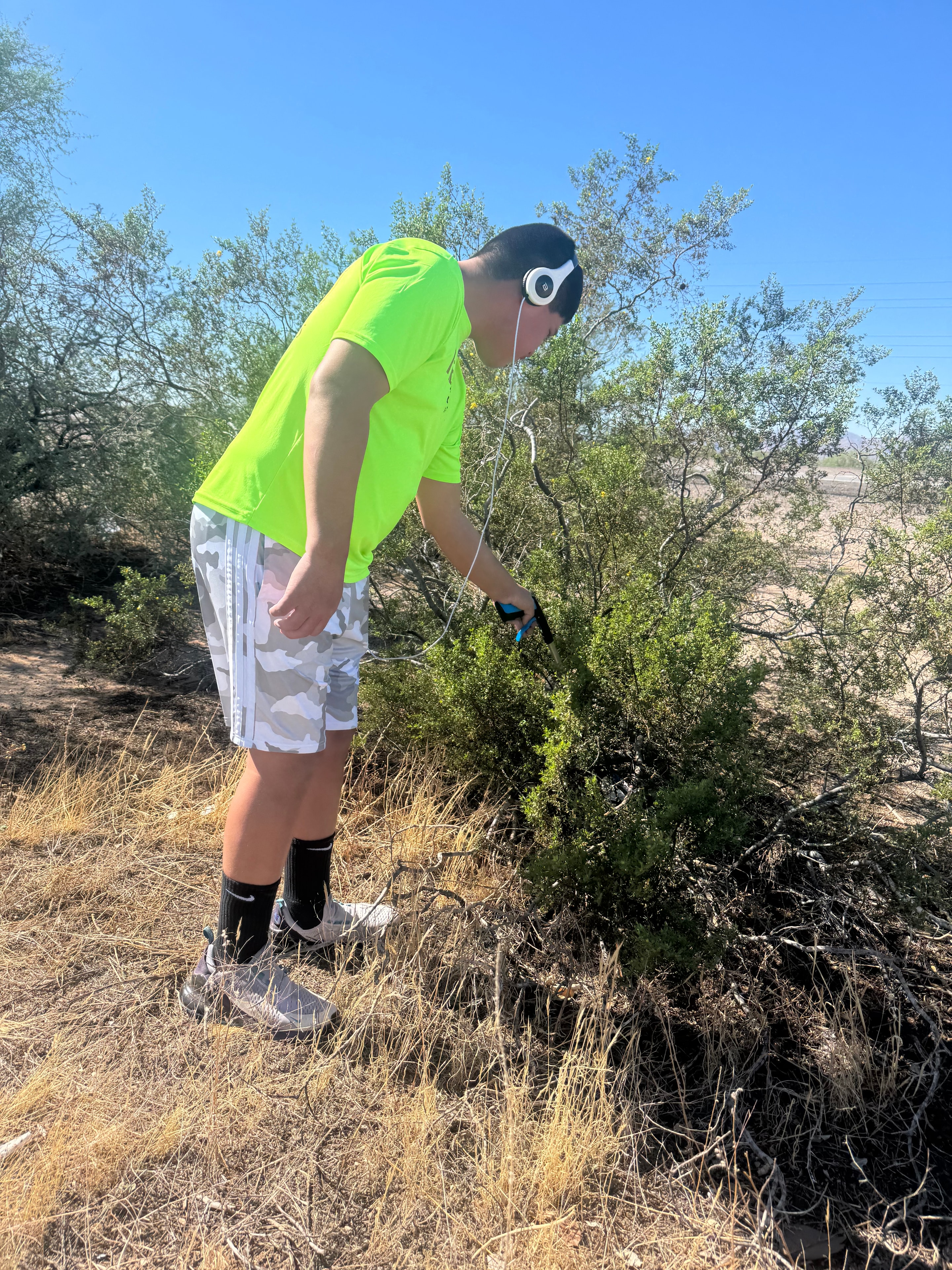 Participant picking up litter during National Clean Up Day with ADOT